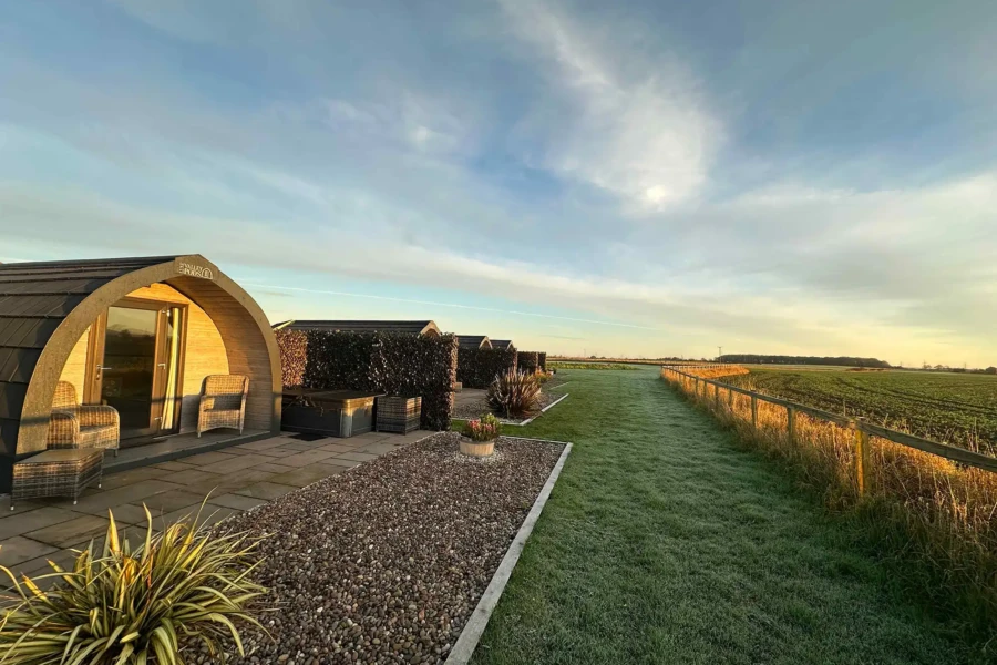 Row of glamping pods purchased via HP financing sourced by AG Credit